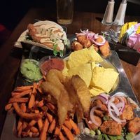 Vegan platter with cauli wings that they had run out of swapped out for tofu (top right), pint at rear for size comparison. This is the 2 person platter. Items as per next menu ima at Lavery's in Belfast