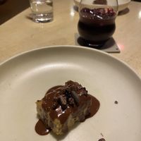Second dessert of the 8 course menu: pudding (or a cake) with chocolate sauce and dried black olives.  at Ali Pacha in La Paz