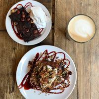 Black bean brownie and baked apple banana bread topped with coconut yoghurt  at SaladPride in London
