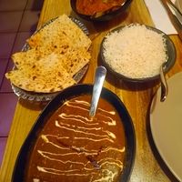 Peshawari naan, dal makhni, rice, and chicken tikka masala. Sensational value in 2026 - just under $60! at Temple of Spices in Mermaid Beach