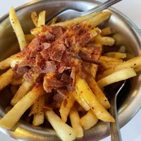 Loaded fries with cheese and bacon  at Comet 984 in Playa Del Carmen