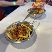 Loaded fries, nachos in background   at Comet 984 in Playa Del Carmen