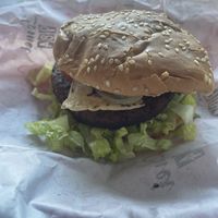 Spicy burger. I didn’t find it spicy at all but I have a high tolerance    at Comet 984 in Playa Del Carmen