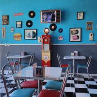 Cool 50s interior with old movies playing on the "TV" at Comet 984 in Playa Del Carmen