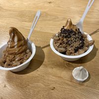 left is hazelnut praline frozen yogurt with cookie butter magic shell and Mexican wedding cookies, right is same yogurt with peanut butter magic shell, choc chips, cookies at Eb & Bean - Broadway in Portland