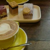 Cappuccino with oatmilk and vegan cakes at Broad Bean Organic Grocer in Southbank