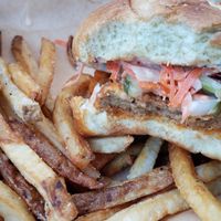 Buffalo seitan sandwich on a potato roll. at Oak House in Newmarket