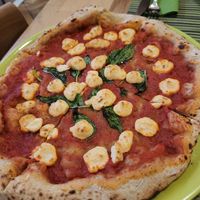 Vegan Margherita pizza with housemade cheese at Vitto Pitagorico in Naples