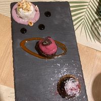 Trio de desserts (coco, chocolat et beurre de cacahuète, datte et fruit rouges)  at Vitto Pitagorico in Naples