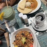 Vegan granola, curry, black coffee and spirulina smoothie   at Los Amigos in Flores