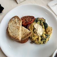 Just egg, tempeh bacon, spinach, mushrooms, vegan cheese scramble with charred tomato, delicious potato croquette, and toastted  at Wynn Hotel - Tableau in Las Vegas