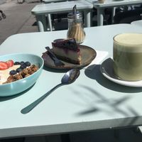 Granola bowl with yoghurt & fruit cheesecake and matcha latte  at Ou Bien Encore in Geneva
