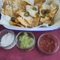 Loaded nachos with sour cream, guacamole and salsa at The Dice Cup in Nottingham