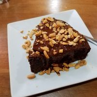 Brownie with peanuts on top. at The Vegan Temple by Prasada in Cusco