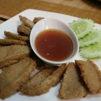 Crispy fried faux pork with sweet chilli dipping sauce. Very delicious at Sai Than Boon in Phuket