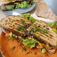 XL toast (was huge) with mashed chickpeas, avocado, tomato, lettuce, marinated red onion. This was delicious! at Saudade in Sintra