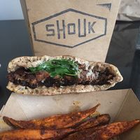 burger and sweet potato fries  at Shouk in Washington
