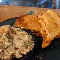 Hot Tempeh Sandwich with potato salad - perfect combo! at Graze in Nashville