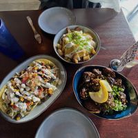 Loaded potatoes, guacamole tostadas, and Szechuan Brussels sprouts  at Graze in Nashville