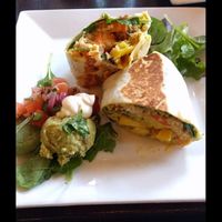 Breakfast burrito:
seitan chorizo, cashew cheese, tofu scramble, roasted potatoes, quinoa, spinach and hollandaise. served with guacamole salad #Veganuary at Graze in Nashville