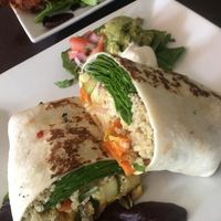 Root veggie burrito and seitan buffalo wings in the background!!! 10/10!!! at Graze in Nashville