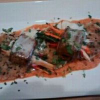 Daily special, veg wrapped in eggplant with tomato cashew sauce and coconut cream at Poppycock's in Traverse City