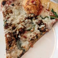 Vegan pizza with herb vinaigrette tempeh at Mellow Mushroom in Coralville