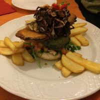 vegan burger with  caramelised onions, breaded aubergine, and spinach pattie at Dolmen Bar in Lanzarote