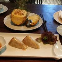 Macadamia & pineapple fried rice and vegetable spring rolls. at Uu Dam Chay in Hanoi