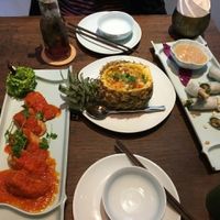 Mushroom stuffed tofu in tomato sauce, macadamia fried rice and fresh mushroom spring rolls  at Uu Dam Chay in Hanoi