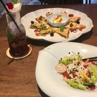So good! Non-alcoholic blueberry mojito, quesadilla, and jicama salad.  at Uu Dam Chay in Hanoi