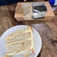Lemon cake slice, and in box; another lemon slice, brownie and coconut square  at 3 Three's Coffee Lounge in Birmingham