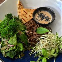 Build your own nourish bowl with soba noodles, tofu, sprouts, spinach, seeds, herbs and miso-tahini dressing. at Greenlight Cafe & Bar in Koh Samui