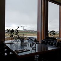 View of Reykjavík from the bistro, set on the University of Iceland grounds, adjacent to Hljómskálagarðurinn Park. at Aalto Bistro in Reykjavik