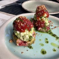 Figs with vegan feta, tomato marmelade and pesto, topped with sesame and oil  at Yard of Taste in Zakynthos