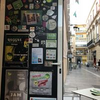 Door and street  at Green Iguana Bar in Malaga