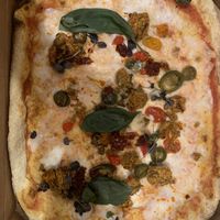 Aubergine “meatball” pizza with vegan cheese   at Zizzi in Wokingham
