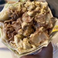 Breakfast burrito with asada and guaccamole  at Taqueria La Venganza in Oakland
