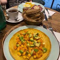 A chickpea pancake with roasted veg and avocado (closest) and a deconstructed vegan burger (further away)  at Carduccio in Florence