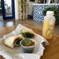 avocado naanwich, mango pineapple juice, cucumber salad  at Karma Juice Bar and Eatery in St Petersburg