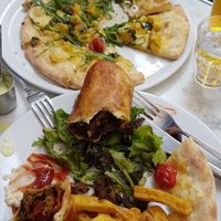 Kabab sandwhich and pizza at Janine Loves Sunday in Paris
