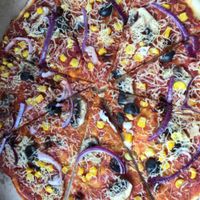 my partner's pizza at La Boheme in Findhorn