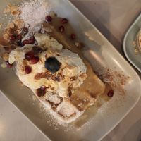 Waffle with apple sauce, vanilla ice cream, almonds and whipped cream at Cafe Neue Liebe in Berlin