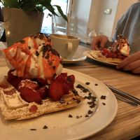 waffles with strawberries, ice cream and whipped cream (all vegan)  at Cafe Neue Liebe in Berlin