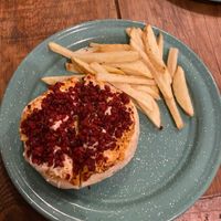 Pizza burger with fries at Vegarum in Monterrey