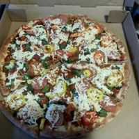 Pizza with spinach, vegan pepperoni, banana peppers, and Daiya cheese. at Panago Pizza in Toronto