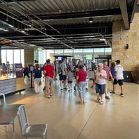 Behind section 101 and 142 behind yellow structure on field next to the Toyota tent it’s tucked away back there by the window  at Visiting Vegan in Arlington