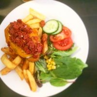 Vegan parmo with spicy  at The Green Room in Middlesbrough