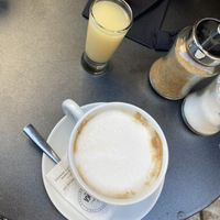 Vegan cappuccino and ginger shot  at Fontana in Athens