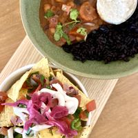 Chilli bowl with black rice and cashew cream… yum! And posh nacos 💕  at Earthlings in Bolton